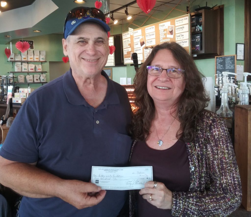 Presenting donation to Bobby White Foundation